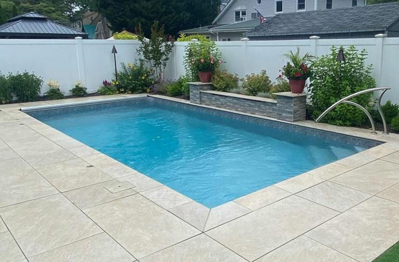traditional concrete gunite pool porous surface high maintenance backyard pool