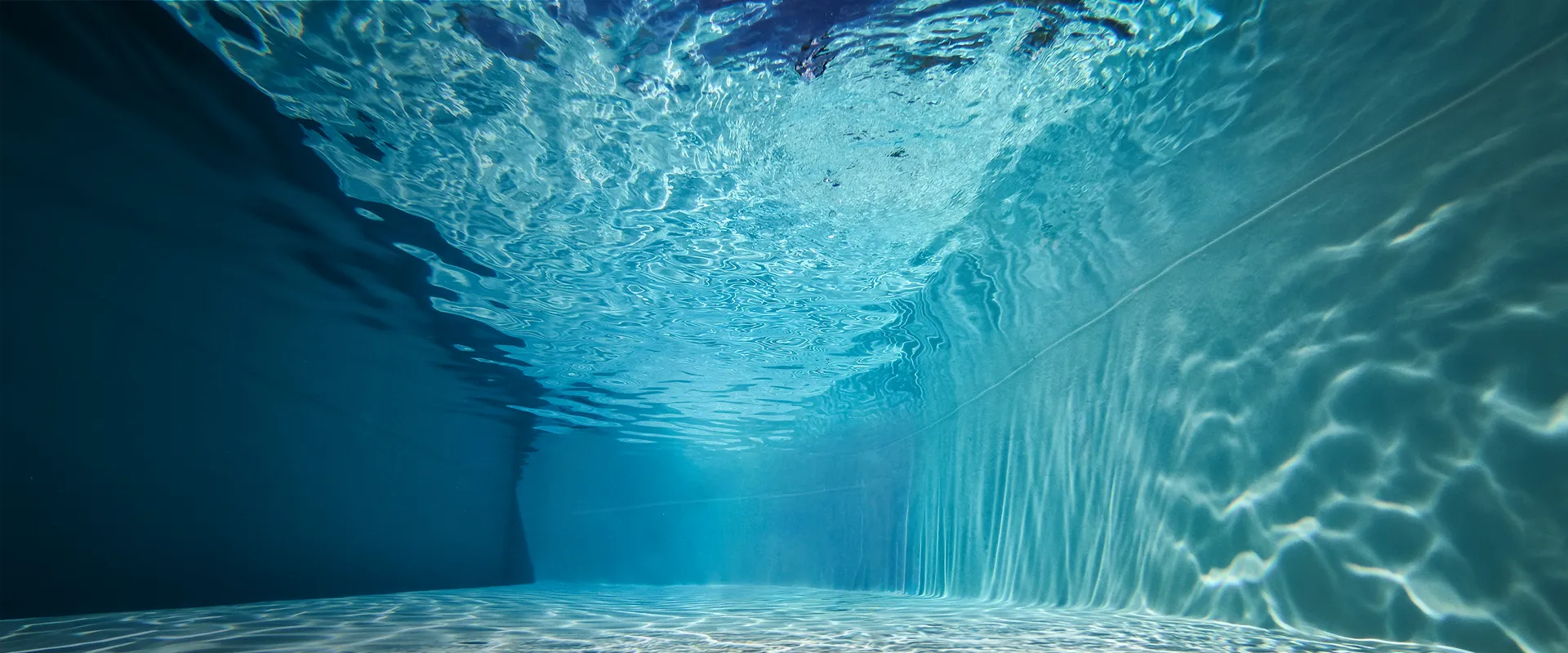 Interior view of a Granita™ pool with crystal-clear water