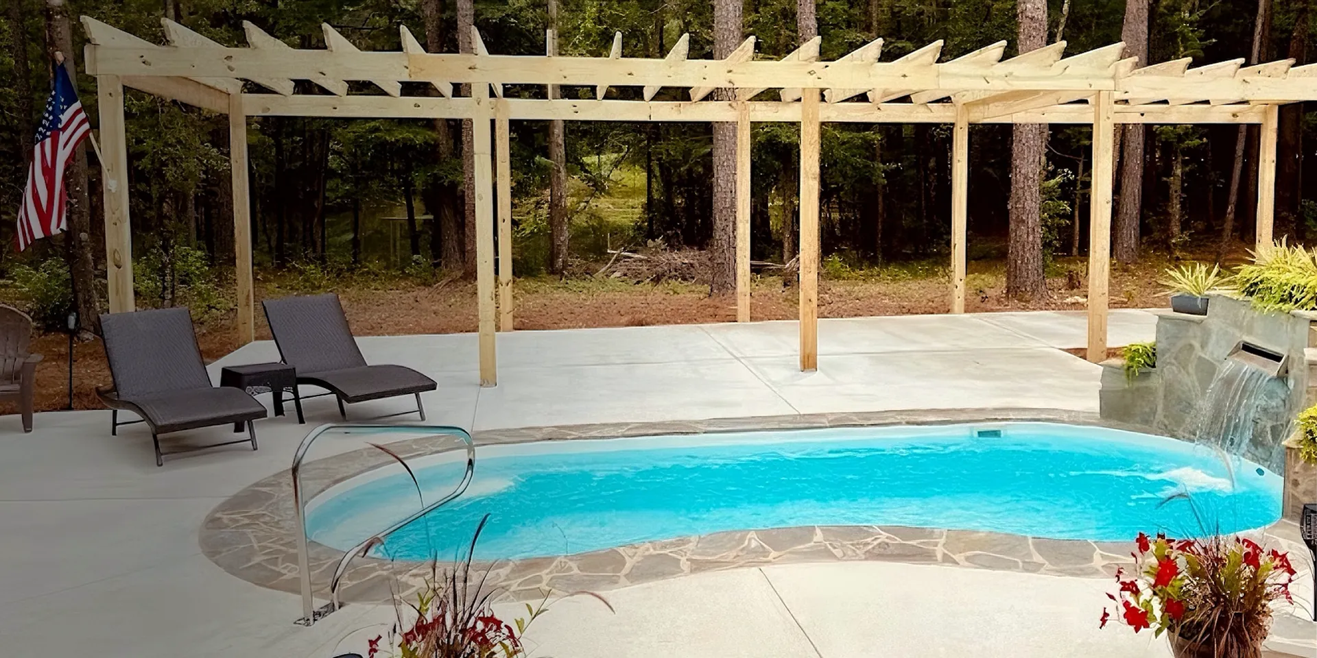 Granita Fiber pool in a backyard with pergola and waterfall — private label pools